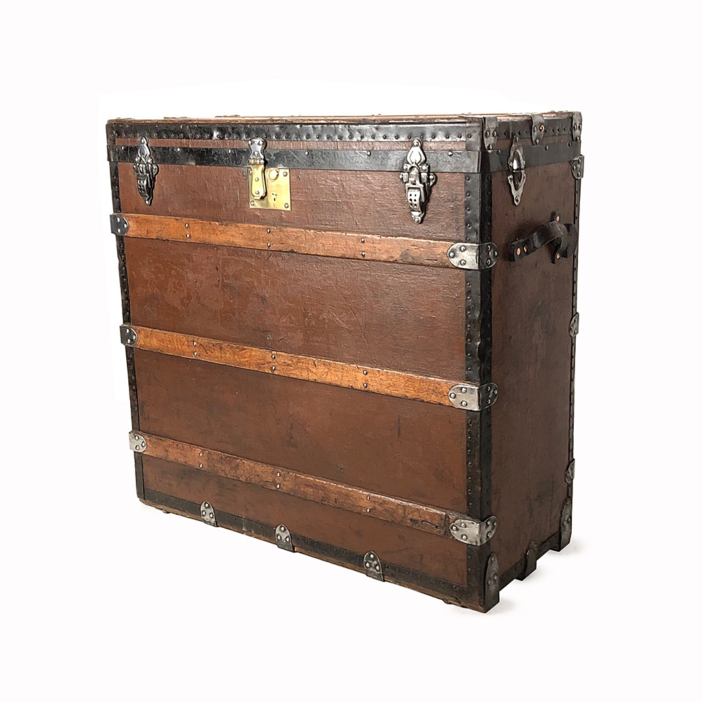TALL TAN TRAVEL TRUNK WITH WOOD SLATS AND BLACK METAL TRIM 81 CM HIGH 84 CM WIDE 35 CM DEEP